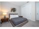 Bedroom with a queen bed, mid-century modern furniture, and large closet at 9043 Sunshine Ridge Loop, Kissimmee, FL 34747