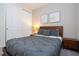 Guest bedroom with a queen bed and ample closet space at 9043 Sunshine Ridge Loop, Kissimmee, FL 34747