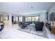 Spacious living room with large sectional sofa and modern decor at 9043 Sunshine Ridge Loop, Kissimmee, FL 34747