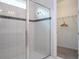 Large shower with glass enclosure and tile surround at 9043 Sunshine Ridge Loop, Kissimmee, FL 34747