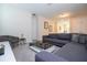 Spacious game room with sectional sofa and a pool table at 9043 Sunshine Ridge Loop, Kissimmee, FL 34747