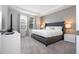 Spacious main bedroom with plush bed and large window at 9043 Sunshine Ridge Loop, Kissimmee, FL 34747