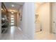 Bright entryway with tile flooring and access to laundry room at 9043 Sunshine Ridge Loop, Kissimmee, FL 34747
