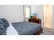 Comfortable bedroom with a queen bed and en-suite bathroom access at 9043 Sunshine Ridge Loop, Kissimmee, FL 34747