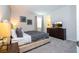 King bedroom with large bed and en-suite bathroom at 9043 Sunshine Ridge Loop, Kissimmee, FL 34747