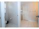 Clean bathroom with toilet, shower, and tiled floor at 9043 Sunshine Ridge Loop, Kissimmee, FL 34747