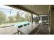 Screened-in pool and patio with seating and dining areas at 9043 Sunshine Ridge Loop, Kissimmee, FL 34747