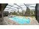 Enjoy this screened pool and spa with comfortable seating at 9043 Sunshine Ridge Loop, Kissimmee, FL 34747
