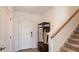 Bright entryway with coat rack and staircase at 5736 Le Marin Way, Kissimmee, FL 34758