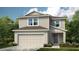 Two story home with gray siding and a teal door at 5736 Le Marin Way, Kissimmee, FL 34758