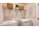 Convenient laundry room with washer, dryer, and ample shelving at 5736 Le Marin Way, Kissimmee, FL 34758