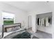 Bright bedroom with a large closet and a view at 1910 Lakeview Ln, Poinciana, FL 34759