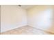 Bright bedroom with tile floors and double door closet at 1910 Lakeview Ln, Poinciana, FL 34759