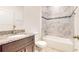 Bathroom with granite vanity and tile shower/tub combo at 1910 Lakeview Ln, Poinciana, FL 34759