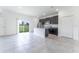Open concept kitchen with island and view to living area at 1910 Lakeview Ln, Poinciana, FL 34759