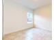 Well-lit bedroom featuring a window and tile floors at 1910 Lakeview Ln, Poinciana, FL 34759