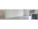 Open concept living area with access to patio and kitchen at 1910 Lakeview Ln, Poinciana, FL 34759
