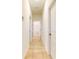 Hallway with tile floors and access to bedrooms and laundry at 1910 Lakeview Ln, Poinciana, FL 34759