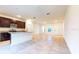 Open concept kitchen with island and view to living area at 1910 Lakeview Ln, Poinciana, FL 34759