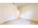 Spacious bedroom with tile floors and double door closet at 1910 Lakeview Ln, Poinciana, FL 34759