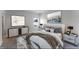 Main bedroom with a king-size bed, stylish decor, and ample space at 1910 Lakeview Ln, Poinciana, FL 34759