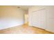 Bright bedroom with tile floors and double-door closet at 1910 Lakeview Ln, Poinciana, FL 34759