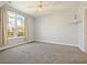 Bedroom with large window, city view and carpeted floor at 202 E South St # 6042, Orlando, FL 32801