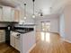 Open concept kitchen with hardwood floors and breakfast bar at 202 E South St # 6042, Orlando, FL 32801