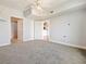 Bright bedroom with ceiling fan and carpeted floor at 202 E South St # 6042, Orlando, FL 32801