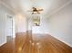 Spacious living room featuring hardwood floors and built-in shelving at 202 E South St # 6042, Orlando, FL 32801