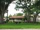 Community area with picnic tables and landscaping at 4367 Thornbriar Ln # 202, Orlando, FL 32822