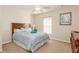 Simple bedroom with a queen-size bed and neutral color scheme at 803 Sandy Ridge Dr, Davenport, FL 33896