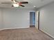 Bright bedroom with ceiling fan and carpeted floors at 3462 Barina St, Saint Cloud, FL 34769