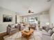Bright and airy living room featuring comfortable seating and access to a backyard patio at 6311 Alamanda Hills Dr, Lakeland, FL 33813
