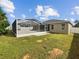 Large backyard with a screened-in patio, perfect for outdoor entertaining at 6311 Alamanda Hills Dr, Lakeland, FL 33813