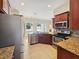 Modern kitchen with stainless steel appliances and granite countertops at 6311 Alamanda Hills Dr, Lakeland, FL 33813