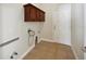 Laundry room with cabinets and hookups for washer/dryer at 6311 Alamanda Hills Dr, Lakeland, FL 33813
