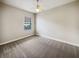 Well-lit bedroom with neutral wall colors and carpeting at 6311 Alamanda Hills Dr, Lakeland, FL 33813
