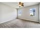 Spacious bedroom with ceiling fan and neutral carpeting at 6311 Alamanda Hills Dr, Lakeland, FL 33813