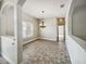 Elegant dining room with chandelier and tile flooring at 6311 Alamanda Hills Dr, Lakeland, FL 33813