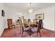 Well-lit dining area with a round table, chairs, and a view to the living room at 734 Riverbend Blvd, Longwood, FL 32779