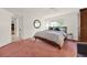 Bright bedroom with carpeted floor and access to hallway at 734 Riverbend Blvd, Longwood, FL 32779