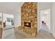 Large stone fireplace with a warm inviting ambiance at 734 Riverbend Blvd, Longwood, FL 32779