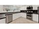 Bright kitchen features white cabinets, stainless steel appliances, and ample counter space at 734 Riverbend Blvd, Longwood, FL 32779