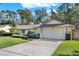 House exterior showcasing a well-maintained lawn and landscaping at 734 Riverbend Blvd, Longwood, FL 32779