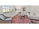 Bright living room with a sectional sofa, accent chair, and large window at 734 Riverbend Blvd, Longwood, FL 32779