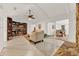 Bright living room with built-in bookcase and fireplace, offering a cozy atmosphere at 734 Riverbend Blvd, Longwood, FL 32779