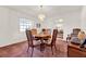 Bright dining room with a round table, four chairs and a chandelier at 734 Riverbend Blvd, Longwood, FL 32779