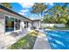 View of the pool and home's exterior, showcasing the patio area at 734 Riverbend Blvd, Longwood, FL 32779