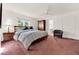 Spacious bedroom with carpeted floor, built-in wardrobe, and ensuite bathroom at 734 Riverbend Blvd, Longwood, FL 32779